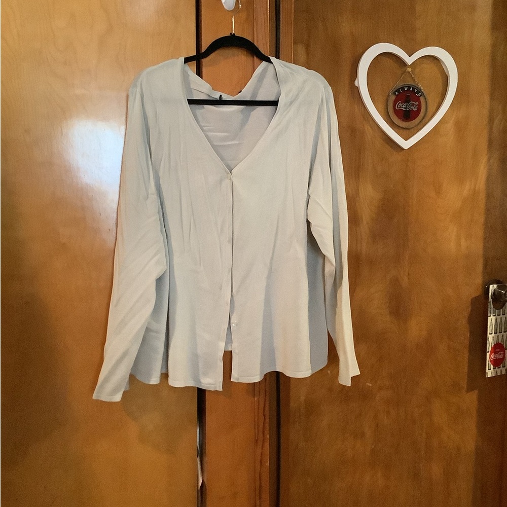 A thin grayish green sweater